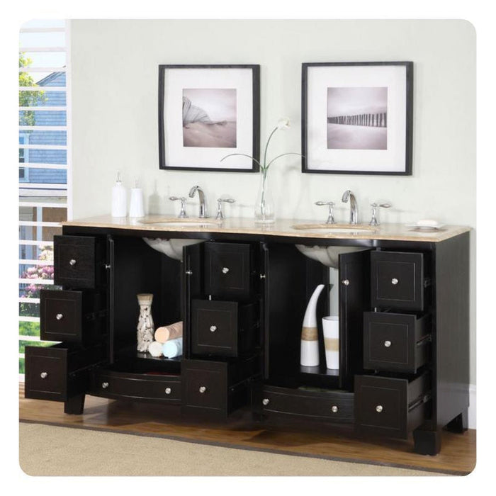 Black bathroom vanity with stone top, two sinks, and multiple open drawers displaying decorative vases and towels, with framed black and white artwork above.