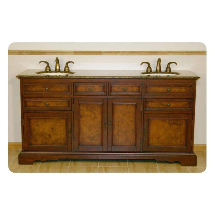 Traditional wooden bathroom vanity with marble top, double sinks, and ornate brass faucets, featuring rich wood tones and decorative panel details.