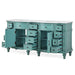 Vintage turquoise console with multiple drawers and cabinet doors, ornate detailing and turned legs.