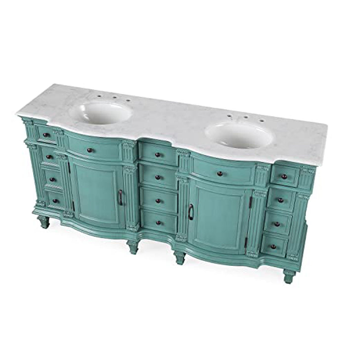 Vintage-style bathroom vanity in soft teal, with curved cabinets, decorative details, and white marble double sink top.