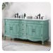 Vintage mint green bathroom vanity with ornate carved details, black fixtures, and white marble top, sitting on a textured rug.