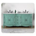Vintage-style seafoam green double vanity with ornate details, white marble top, and black fixtures