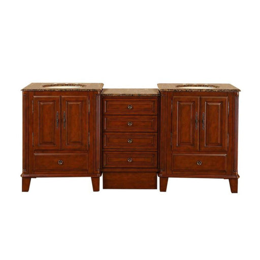 Cherry wood bathroom vanity with marble top, center drawers, and double sink basins