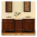 Elegant wooden bathroom vanity with double sinks, ornate brown cabinets, white marble top, and floral wall art above