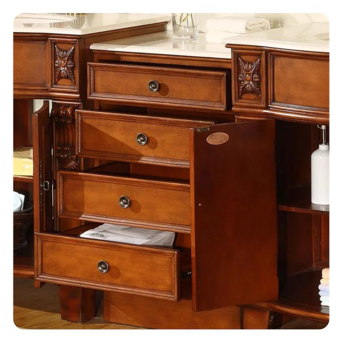 Polished wooden dresser with four open drawers, ornate carved details on sides, round drawer pulls, and a marble countertop.