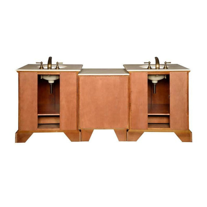 Wooden bathroom vanity with two sinks, white marble countertop, and bronze faucets, featuring open cabinet spaces on sides.