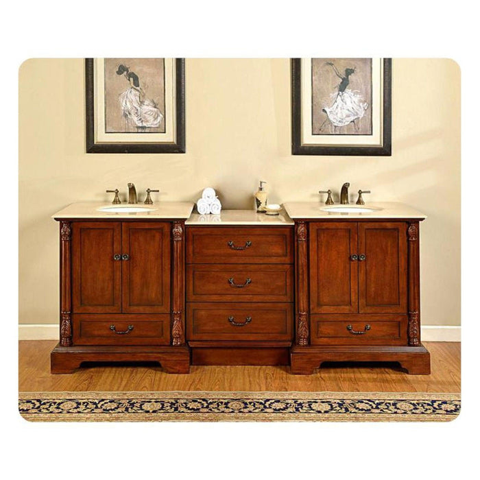 Elegant wooden bathroom vanity with double sinks, marble countertop, and decorative ballet dancer artwork above.
