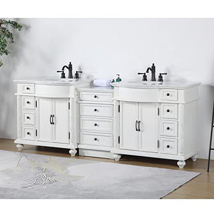 White double vanity with black faucets, six drawers, two cabinets, marble top, and decorative bun feet on a light floor.