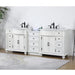 White double vanity with black faucets, six drawers, two cabinets, marble top, and decorative bun feet on a light floor.