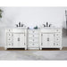 White double vanity with black fixtures, center drawers, and two sinks on a patterned floor rug