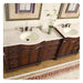 Elegant wooden double bathroom vanity with white marble countertop, two sinks, decorative dark wood cabinetry, and small plant in green vase