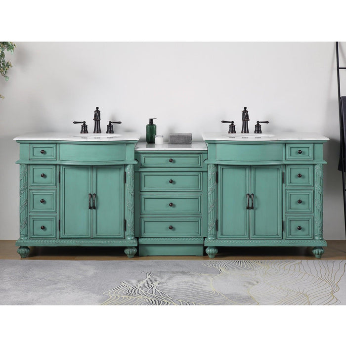 Vintage-style mint green double vanity with white countertops, black fixtures, and multiple drawers and cabinets.