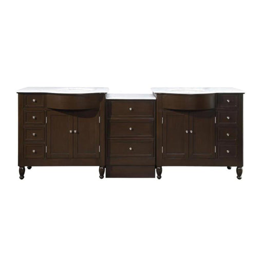 Dark wood double bathroom vanity with white marble top, six drawers and two cabinet doors with round turned legs.