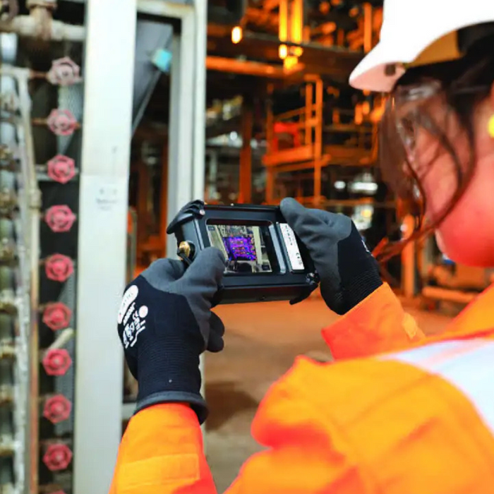 Teledyne FLIR CX5 Hazardous Location Rated Compact Thermal Camera worker using camera in industrial setting.