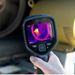 Teledyne FLIR E5 Pro closeup handheld use industrial equipment scan.