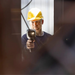 Teledyne FLIR E5 Pro person using camera inspection hard hat.