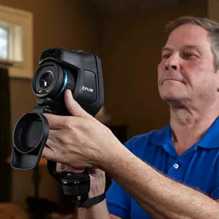 Teledyne FLIR E54 24 person operating camera side view with flir logo.