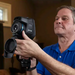 Teledyne FLIR E54 24 person operating camera side view with flir logo.