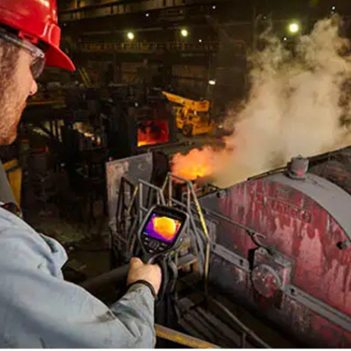 Teledyne FLIR E76 42 14 Advanced Thermal Imaging Camera industrial worker using camera on furnace emission.