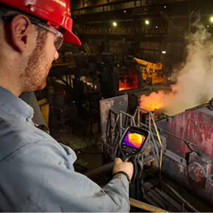 Teledyne FLIR E76 Dual FOV 24 42 worker using thermal camera industrial setting.