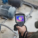 Teledyne FLIR E86 close up machinery scan hand holding camera thermal image.