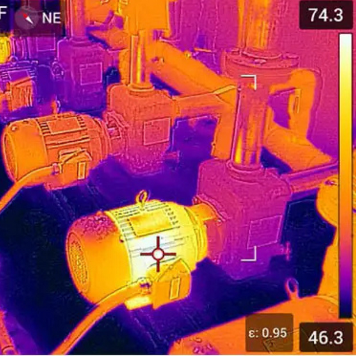 Teledyne FLIR E96 24 42 close up thermal image of industrial motors and piping.