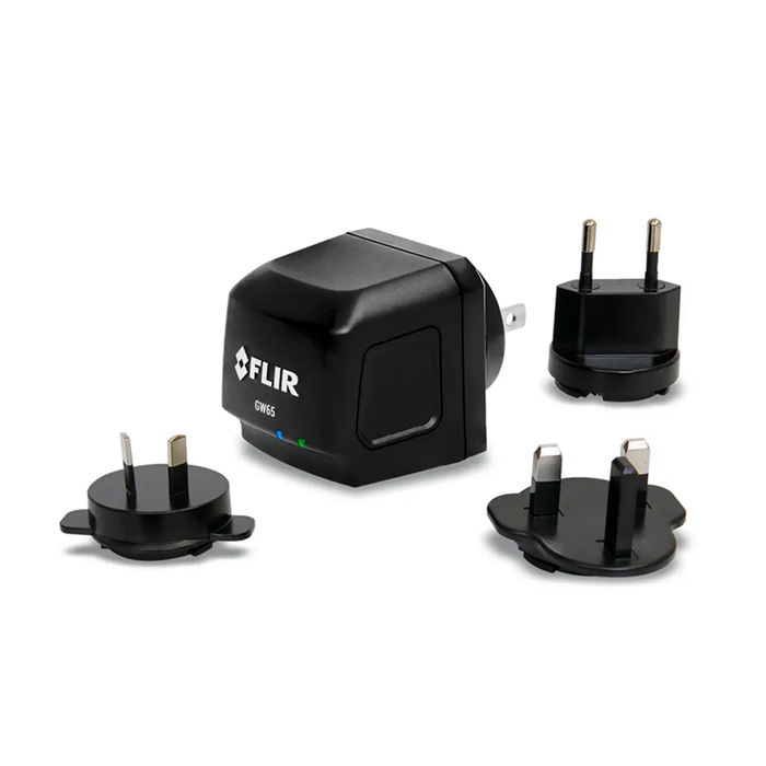 Teledyne FLIR GW65 Remote Monitoring Gateway front view black charger with multiple international adapters.