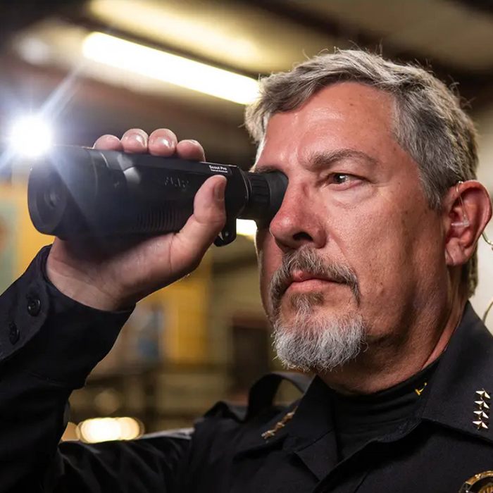 Teledyne FLIR Scout Pro 30Hz 640x480 law enforcement indoor use person looking through scope.