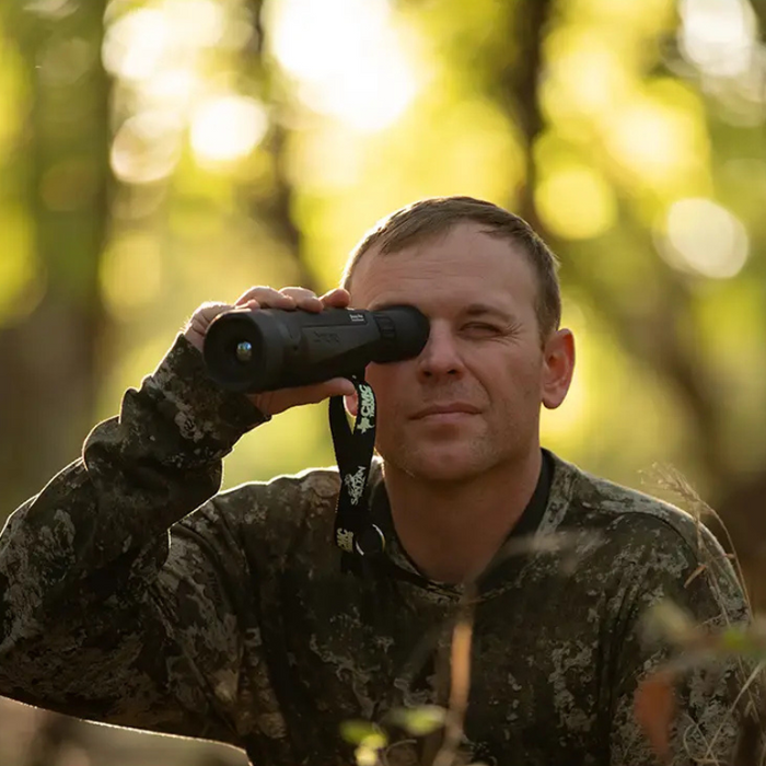 Teledyne FLIR Scout Pro 30Hz 640x480 outdoor use person looking through scope daylight.