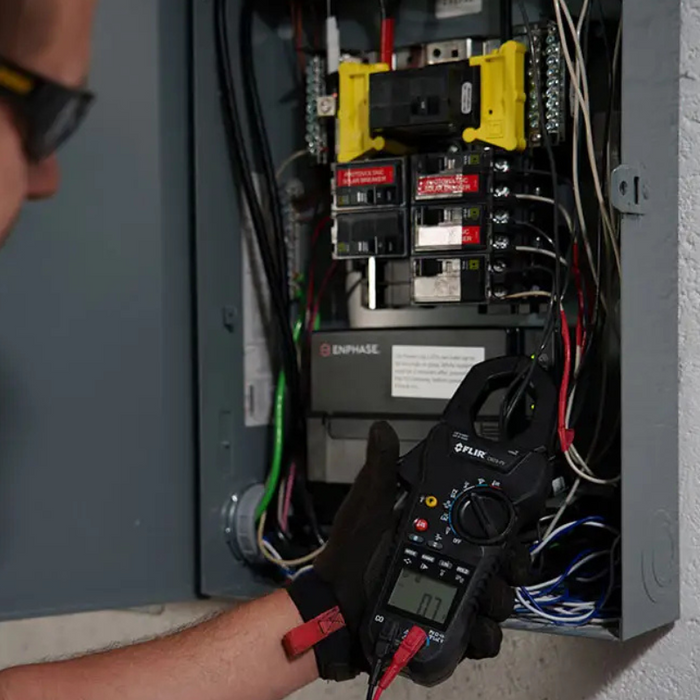 Teledyne FLIR T560 in use electrician testing electrical box.