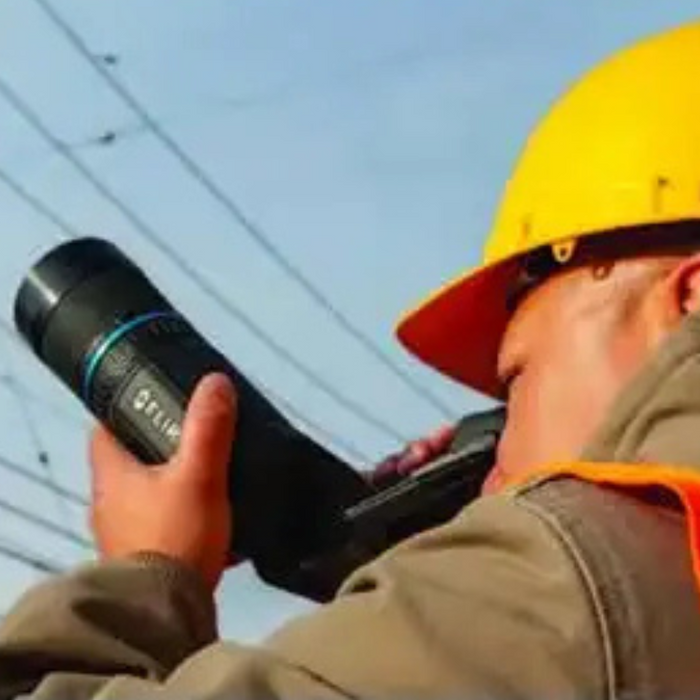 Teledyne FLIR T840 DFOV 24 42 worker using thermal imager outdoors.