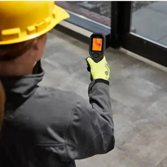 Teledyne FLIR TG165 X construction worker scanning flooring with thermal camera.