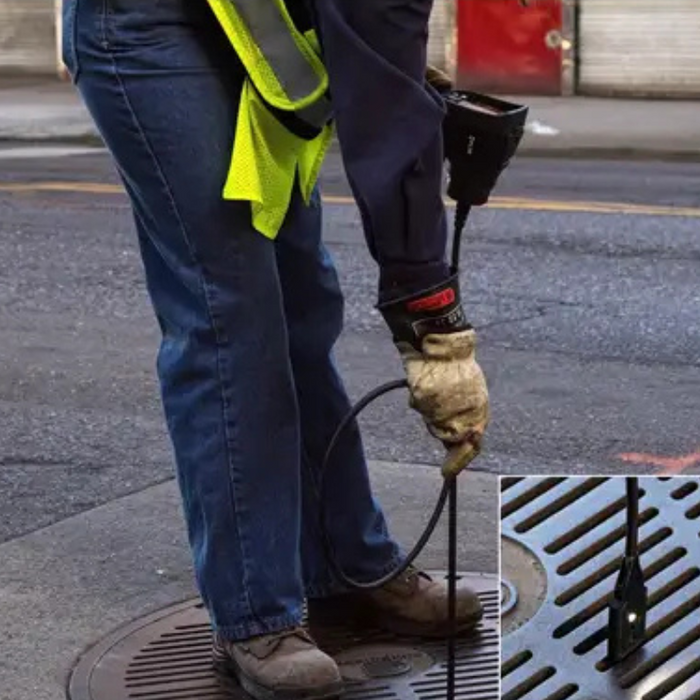 Teledyne FLIR VS290 32 thermal videoscope in use outdoors viewing drain.