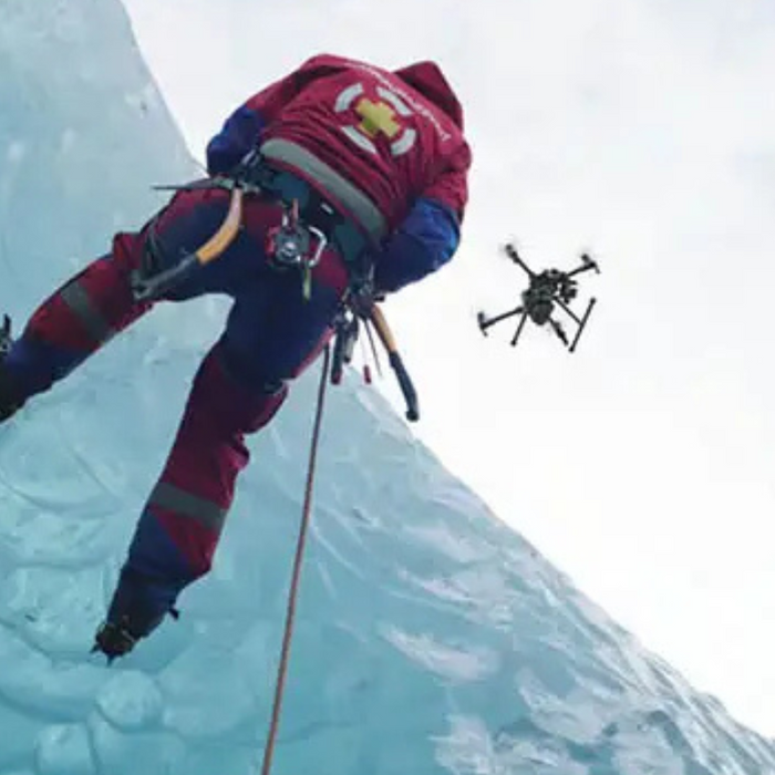 Teledyne FLIR VUE TZ20 60HZ upward view rescue worker ice wall drone hovering.