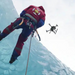 Teledyne FLIR VUE TZ20 60HZ upward view rescue worker ice wall drone hovering.