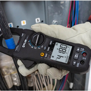 Teledyne Flir Cm85 2 in hand close up electric panel measurement.