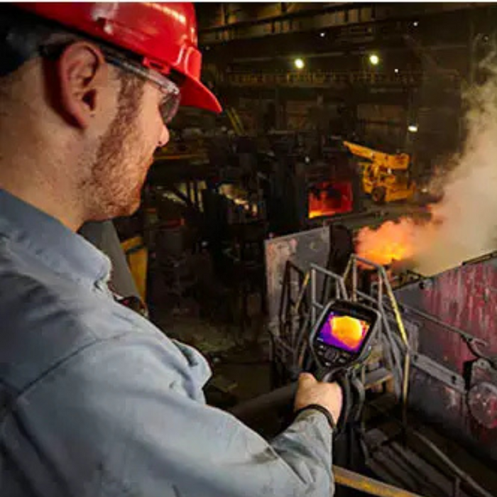 Teledyne Flir E76 42 worker using camera industrial furnace thermal inspection.