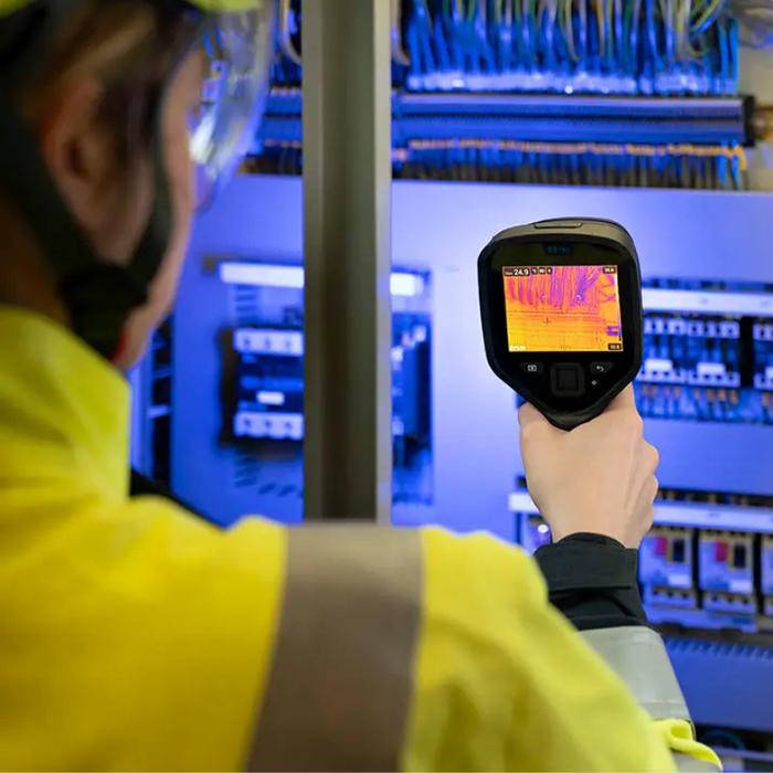 Teledyne Flir E8 Pro Nist person using thermal camera on electrical panel