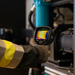 Teledyne Flir E8 Pro Nist person using thermal camera on industrial machinery.