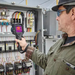 Teledyne Flir E86 24 14 42 Nist technician using camera on electrical panel.