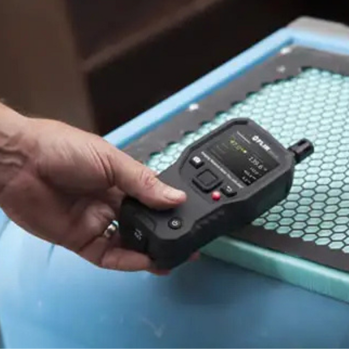 Teledyne Flir Mr176 Kit6 Mr176 person testing surface with moisture meter.