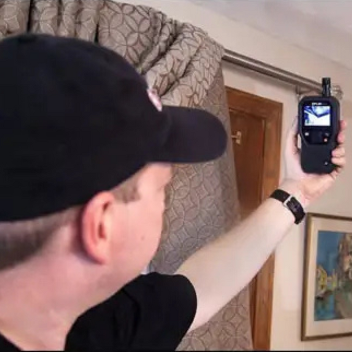 Teledyne Flir Mr176 Kit6 Mr176 person using device on curtain.