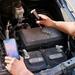 Teledyne Flir One Edge Pro in use on car engine with smartphone.