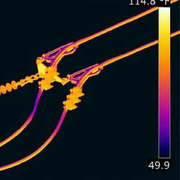 Teledyne Flir T1010 45 thermal image of power lines with temperature gradient.