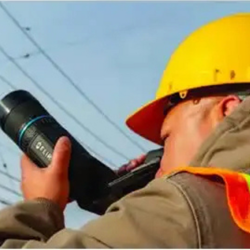 Teledyne Flir T840 14 field operator using thermal camera yellow hard hat.
