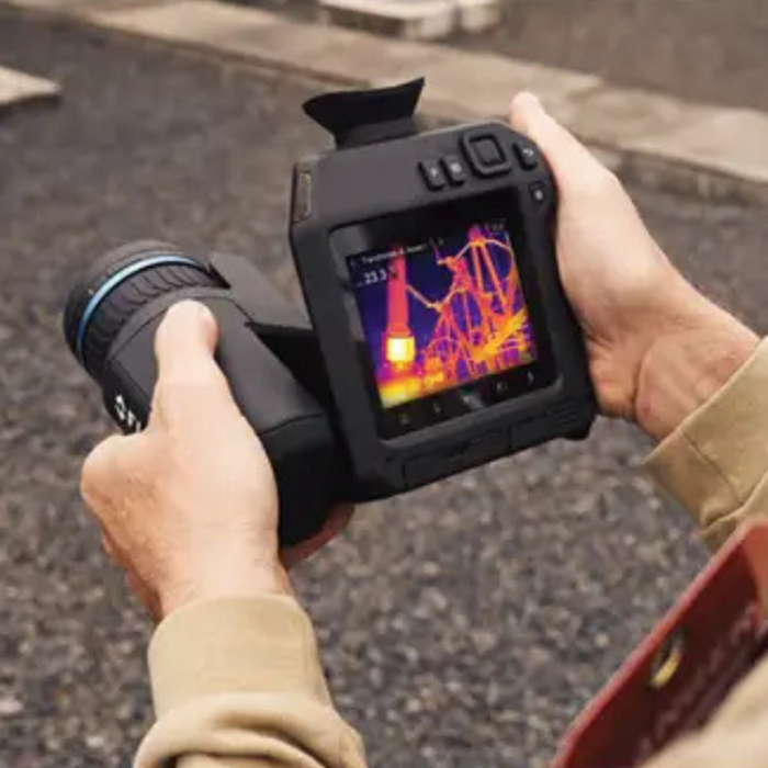 Teledyne Flir T865 24 14 6 handheld view outdoor usage thermal image visible.