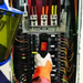 Teledyne Flir Tg267 inspection view technician using thermal camera on electrical panel.