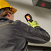 Teledyne Flir Tg268 inspection upward view technician using camera on ceiling vent.