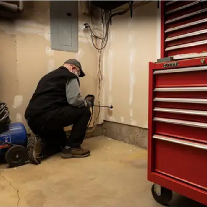 Teledyne Flir Vs290 33 Thermal Msx Videoscope operator using inspection camera on wall.