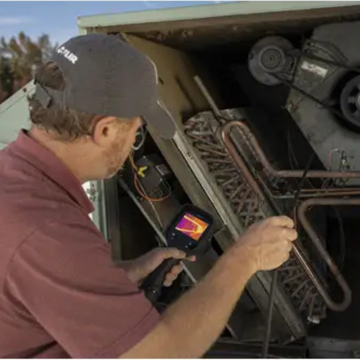 Teledyne Flir Vs290 33 Thermal Msx Videoscope technician using camera on hvac equipment.